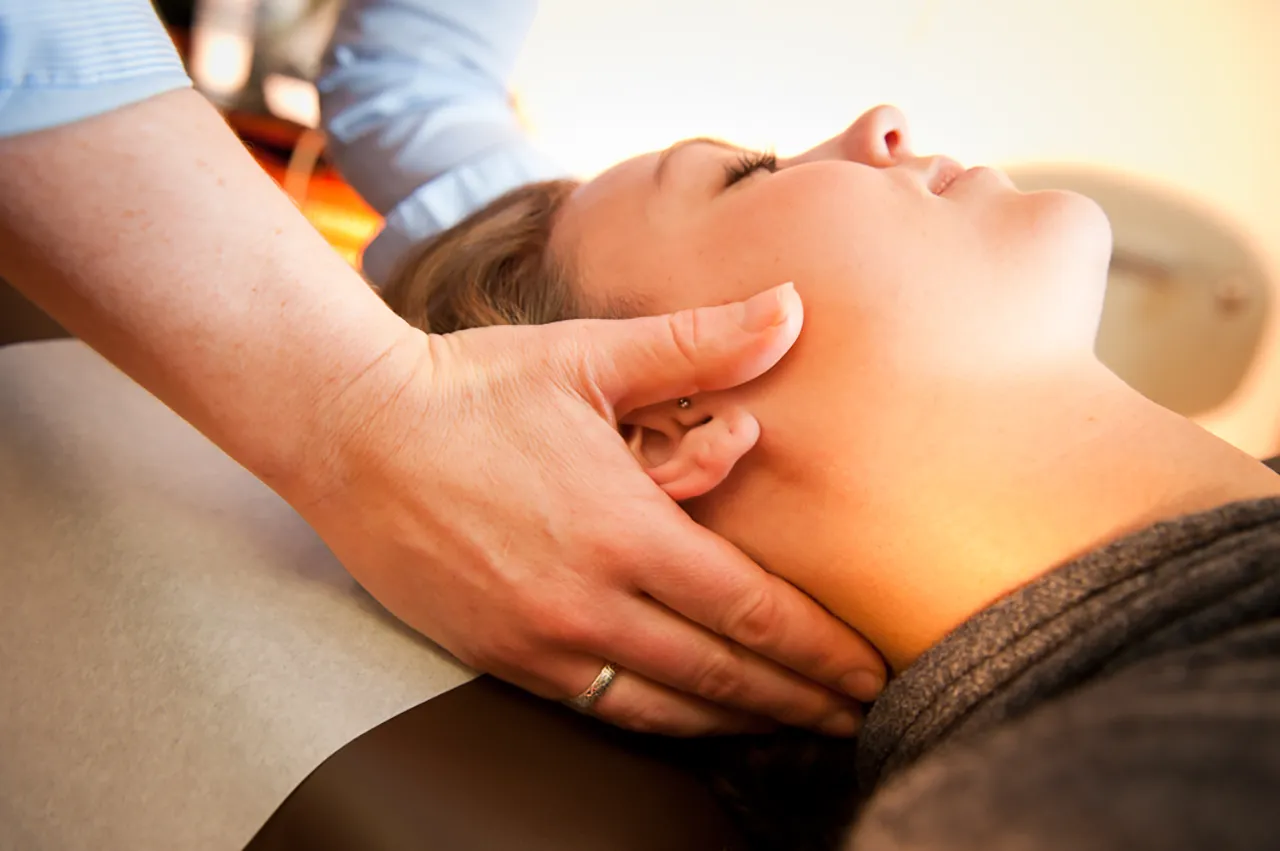 Patient receiving chiropractic care at Blyss
